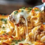 This Sour Cream Noodle Bake is a comforting, cheesy casserole that's perfect for a family dinner. With layers of tender egg noodles, savory beef sauce, and a creamy, tangy noodle mixture, this dish is sure to be a hit.