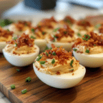 Ingredients for Thanksgiving Deviled Eggs, including eggs, bacon, shallots, sage, and mayonnaise.