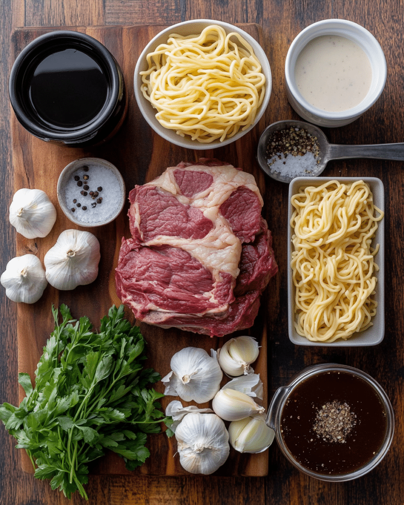 Ingredients for Slow Cooker Beef and Noodles, including beef roast, egg noodles, and soup.