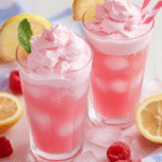 A close-up of Whipped Pink Lemonade, showing the layers of lemonade and whipped cream.