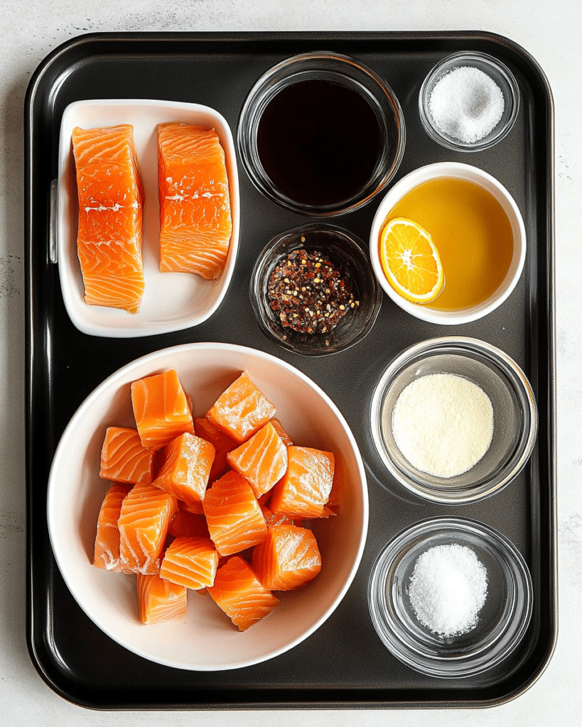 Ingredients for Pan-Fried Orange Salmon, including salmon, oranges, and ginger.