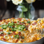 Jalapeño Popper Dip served with crackers and celery sticks.