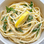 Ingredients for Easy One-Pot Lemon Garlic Parmesan Pasta, including pasta, lemon, garlic, Parmesan, and broth.