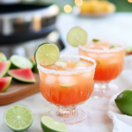 Blending the melon, tequila, lime juice, and ice in a blender for Melon Margaritas.