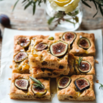 Slices of Whole Wheat Focaccia served on a platter or alongside a cheese board.