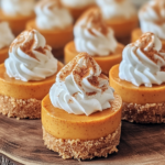 Ingredients for No Bake Mini Pumpkin Cheesecakes, including graham crackers, cream cheese, pumpkin puree, Cool Whip, and spices.