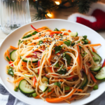 Tossing the cooked noodles and marinated vegetables together for Asian Noodle Salad.