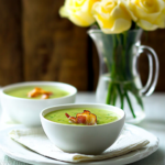 A tray of Green Pea Soup Shots ready to be served as appetizers at a party.