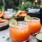 Ingredients for Carrot Ginger Margarita, including fresh carrots, ginger, lime, tequila, Grand Marnier, and simple syrup.  