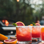 Shaking the ingredients for the Blood Orange Paloma in a cocktail shaker.