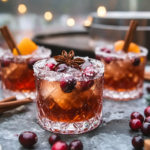 Making the spiced cranberry simple syrup in a saucepan with cranberries and whole spices.