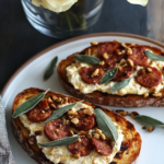 Spreading the pumpkin ricotta mixture onto grilled bread slices for Pumpkin Ricotta Toasts.