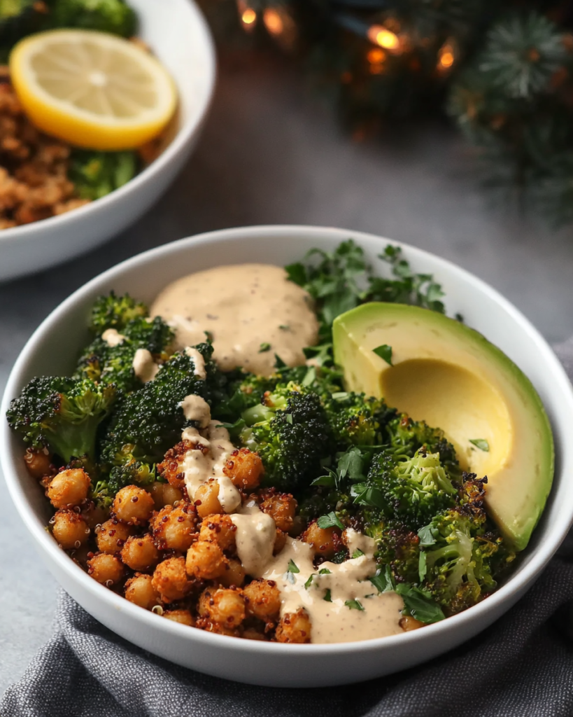  Ingredients for Crispy Quinoa Chickpea Bowls, including quinoa, chickpeas, broccoli, avocado, tahini, lemon, harissa seasoning, and herbs.