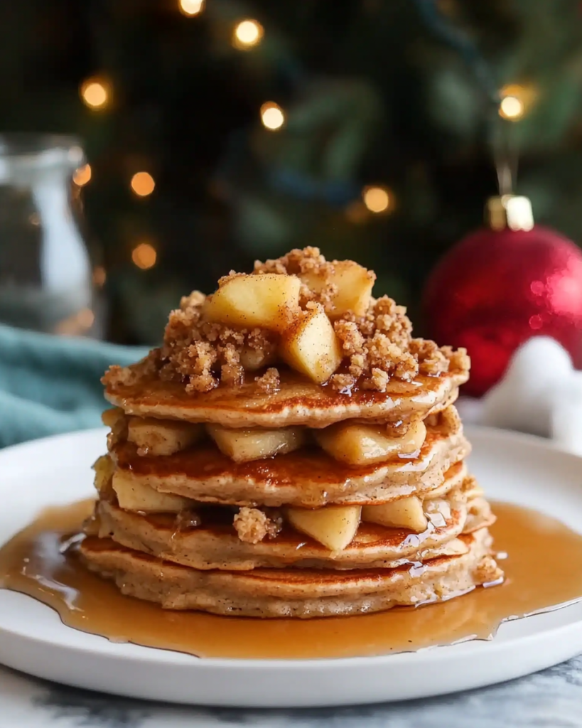  Ingredients for Apple Crisp Pancakes, including apples, flour, buttermilk, oats, brown sugar, maple syrup, and spices.