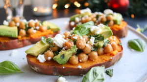 Slices of baked Sweet Potato Toast topped with avocado, lemon basil chickpea salad, and feta.