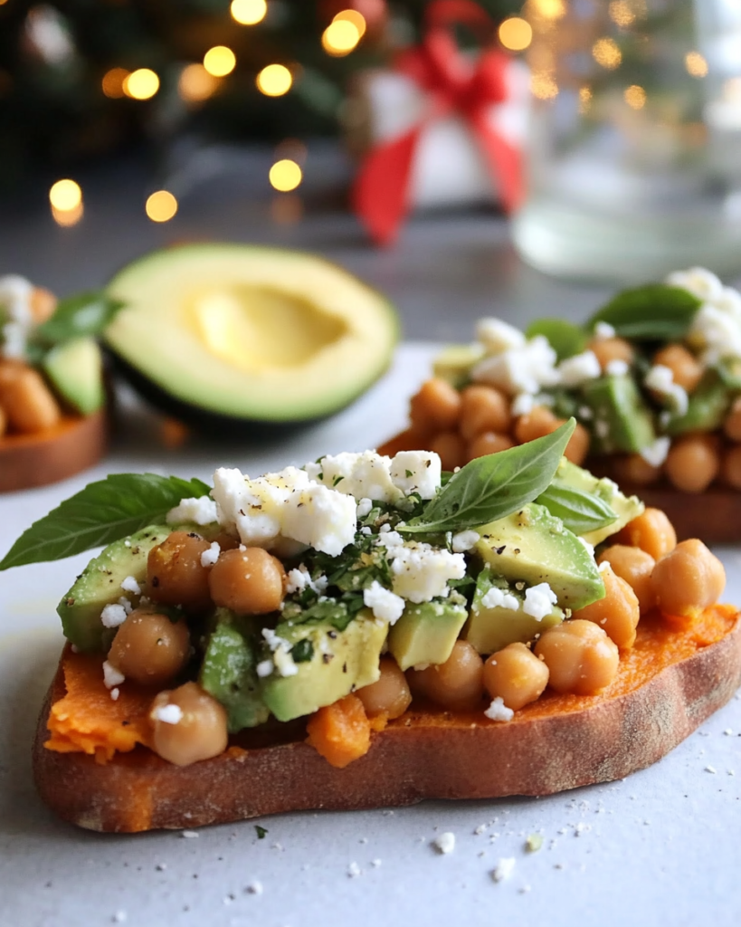 Ingredients for Sweet Potato Toast, including sweet potatoes, avocado, chickpeas, cucumber, feta, basil, lemon, and olive oil.