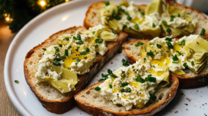 Toasted bread slices (crostini) topped generously with creamy Artichoke Bruschetta spread and garnished with chives.