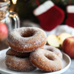 Frying the Apple Cider Doughnuts in hot oil in a Dutch oven or pot.
