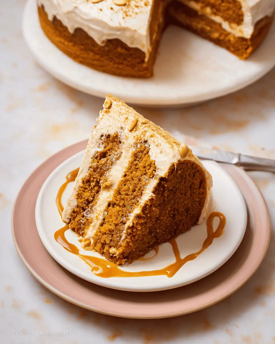 Ultimate Brown Butter Pumpkin Cake (with Dulce de Leche!) 3 An overhead shot of the pumpkin cake, decorated with pumpkin seeds and a dusting of cinnamon.