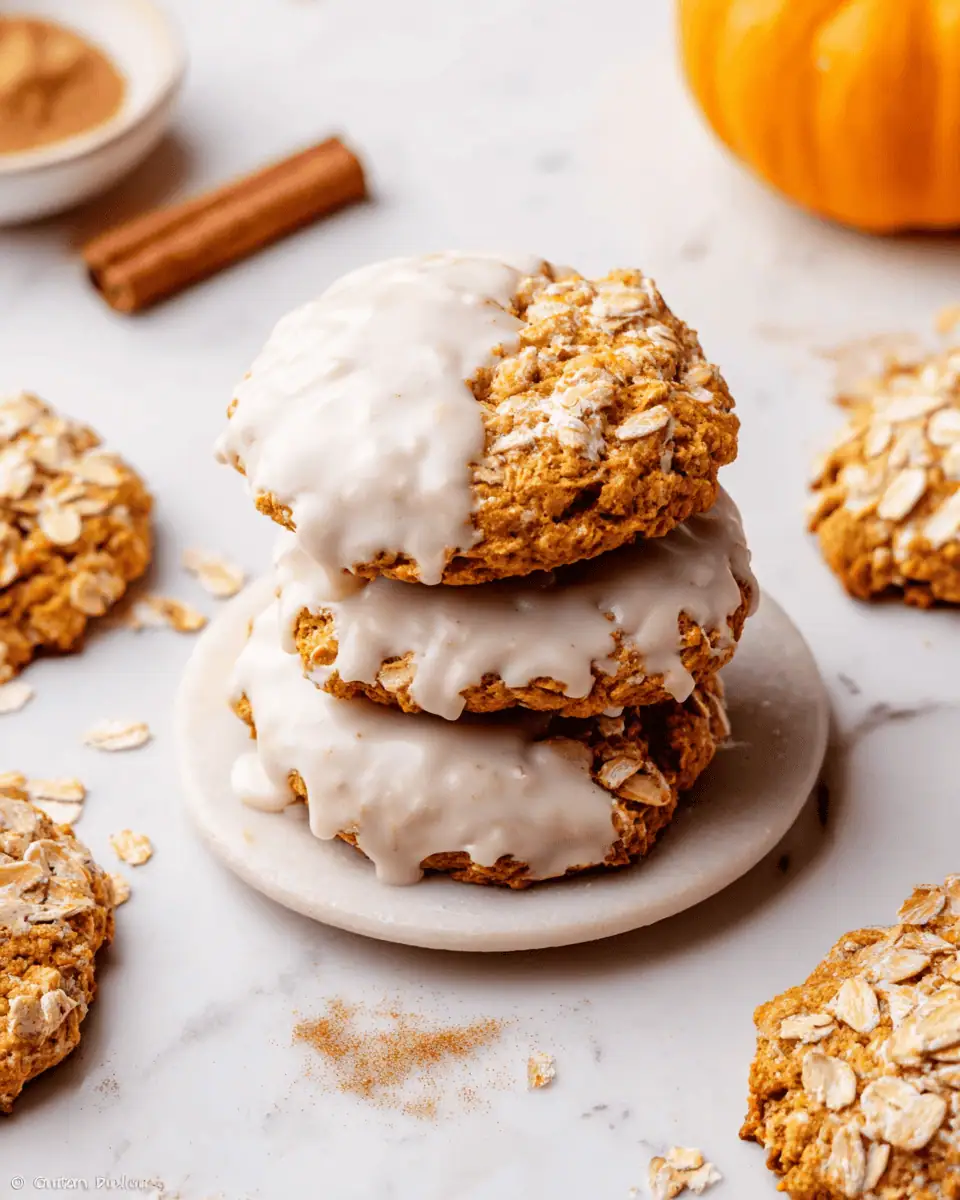 Soft and Chewy Pumpkin Oatmeal Cookies (with Brown Butter!) 1 A stack of chewy pumpkin oatmeal cookies, drizzled with a white maple glaze.