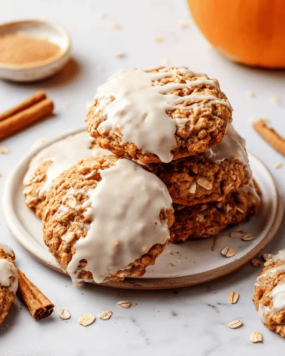 Soft and Chewy Pumpkin Oatmeal Cookies (with Brown Butter!) 2 A close-up of a pumpkin oatmeal cookie, showing the thick maple glaze and the texture of the oats.