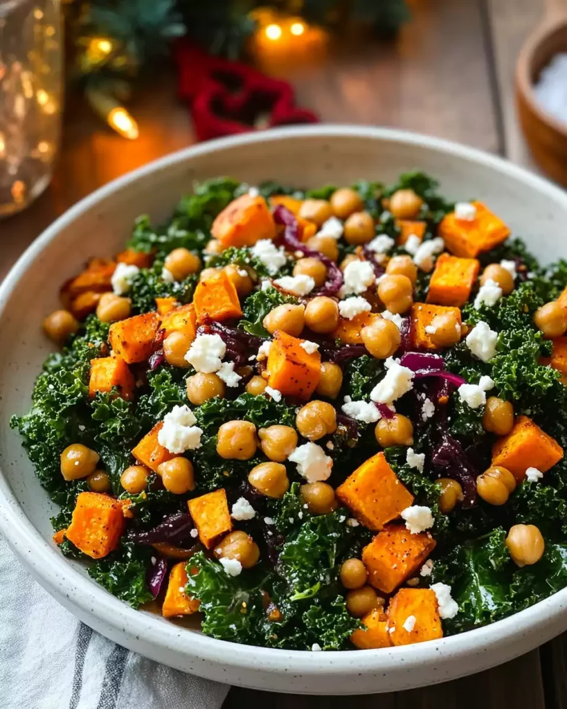 Sweet Potato Kale Salad (Roasted Pepper Dressing & Crispy Chickpeas!) 6 Massaging chopped kale with dressing in a large bowl for the Sweet Potato Kale Salad.